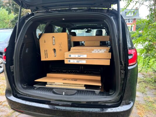 IKEA furniture boxes loaded in a minivan for pickup and delivery in London Ontario